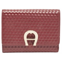 Aigner Portafoglio compatto Genoveva in pelle goffrata bordeaux