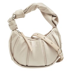TUMI, petit sac à bandoulière Asra en nylon beige