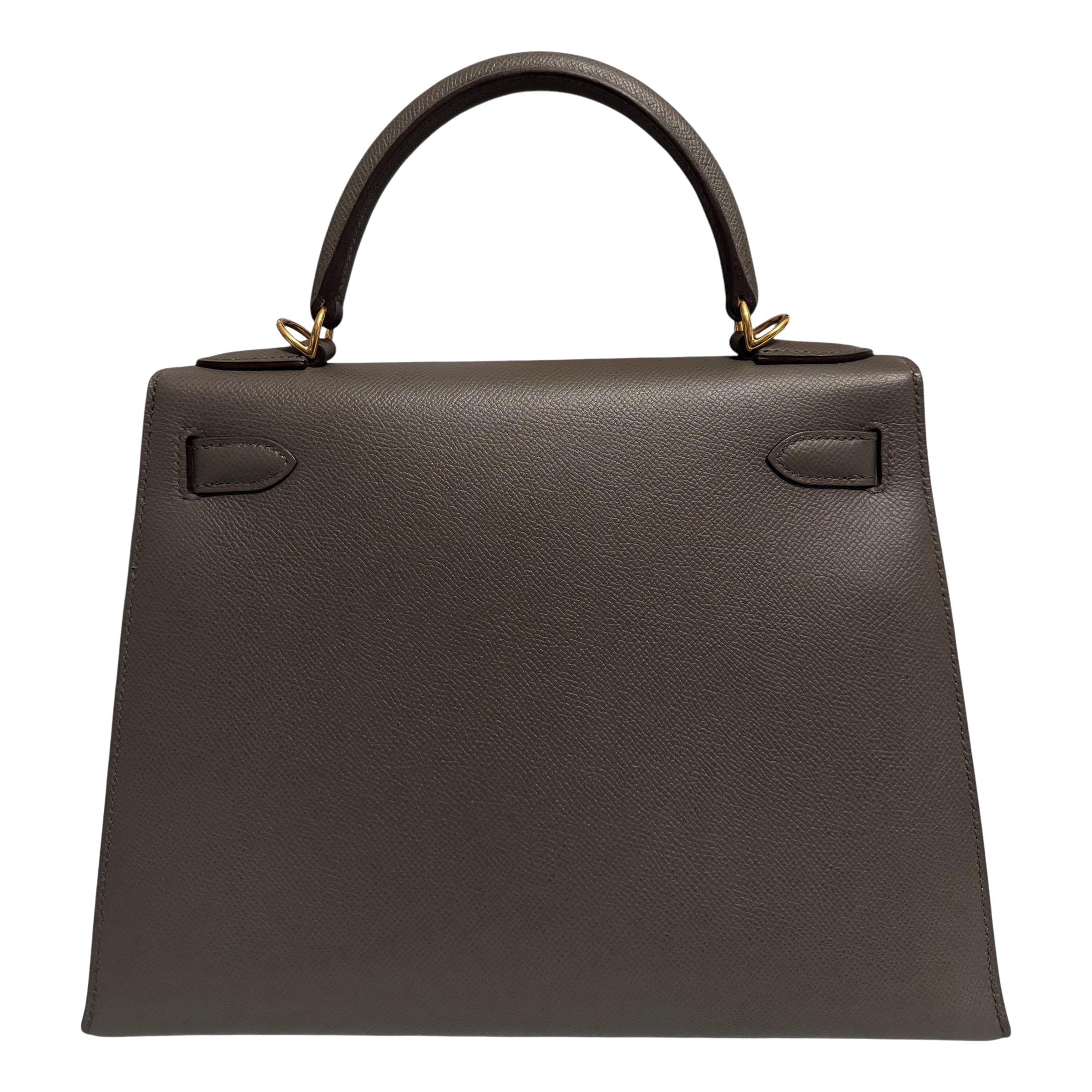 Absolutely Stunning Rare and Most Coveted color. Hermes Kelly 28 Sellier Etain Epsom Leather complimented by Gold Hardware. Pristine Condition with Plastic on all hardware and feet. 
2018 C Stamp. As New Plastic on all Hardware. 
Lux Addicts is a