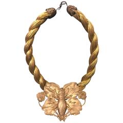 Broche coccinelle en métal pressé Art Nouveau sur collier ras du cou en corde tressée