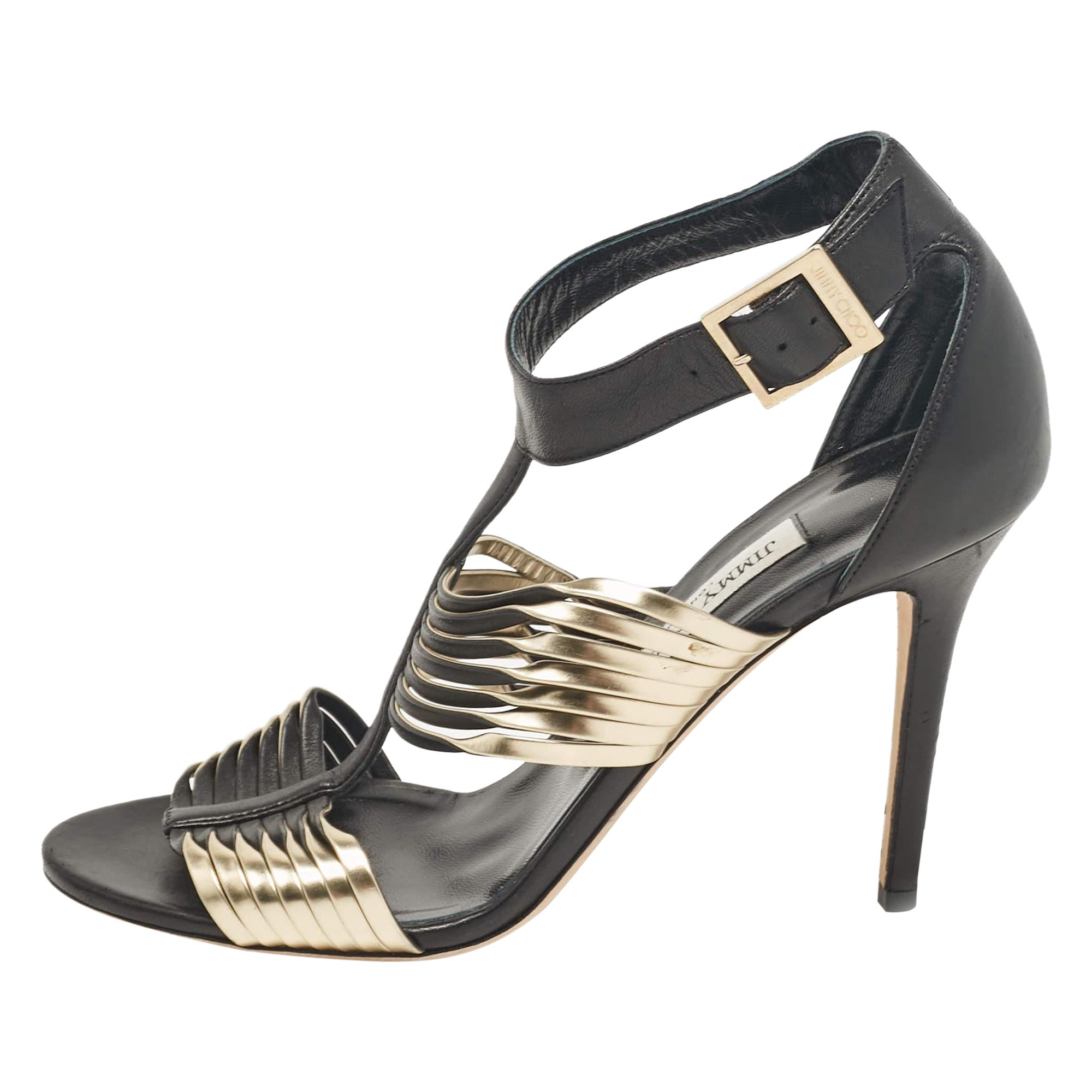 Jimmy Choo Sandali con cinturino alla caviglia in pelle nera/oro misura 39,5 in vendita