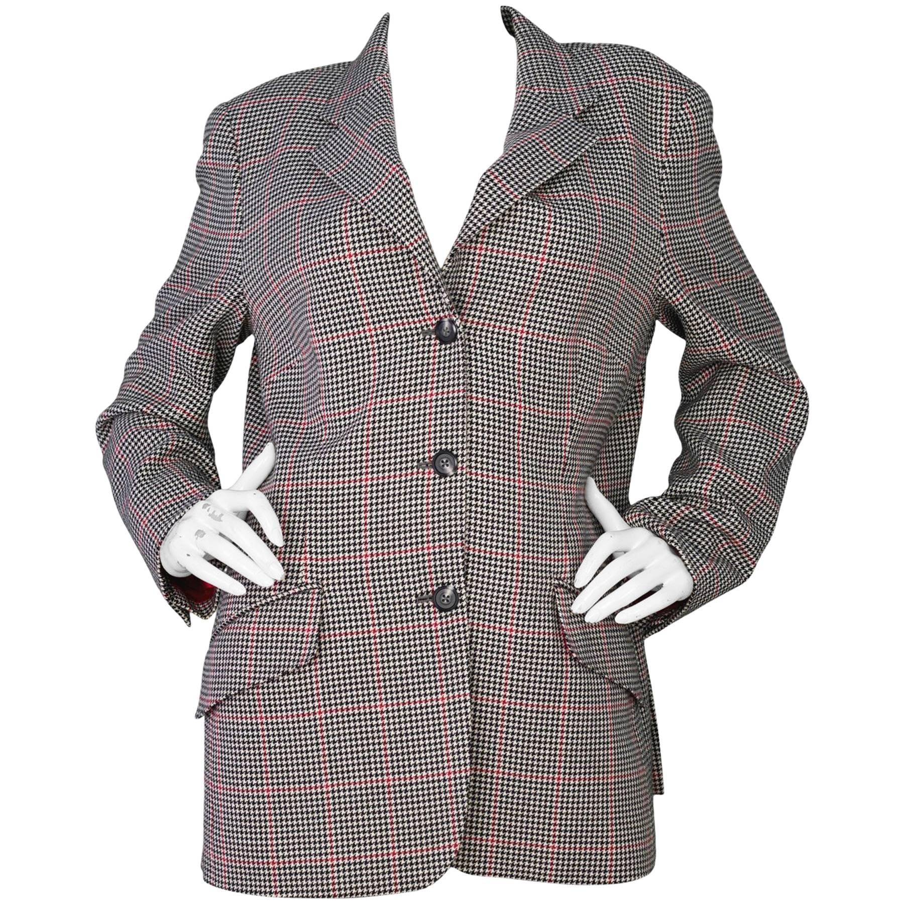 Holland & Sherry Houndstooth Wool Jacket 

Color: Black, beige and red
Composition: 45% silk, 55% worsted wool
Lining: Red, silk-blend 
Closure/Opening: Single breasted button down closure
Exterior Pockets: Two hip flap pockets
Interior Pockets: