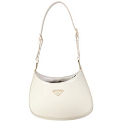 Borsa Cleo di Prada in vernice avorio