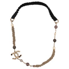 Chanel Champagne Metal Head Jewelry