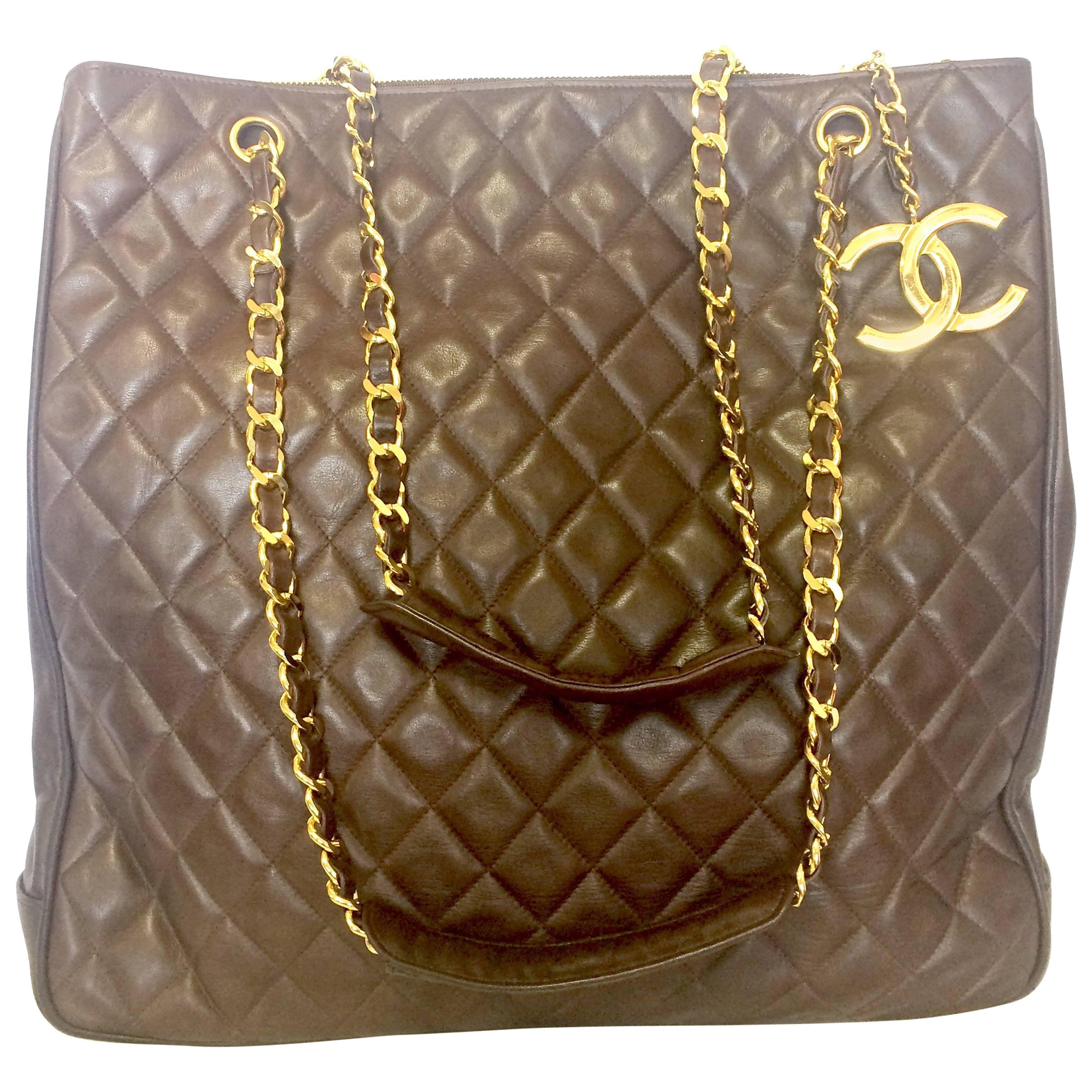 Vintage CHANEL brown lambskin large tote bag with gold tone chains and CC charm. For Sale