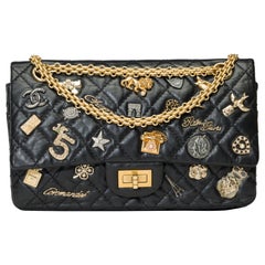 Lucky Charms 2.55 Chanel double flap shoulder bag in black quilted leather, AGHW