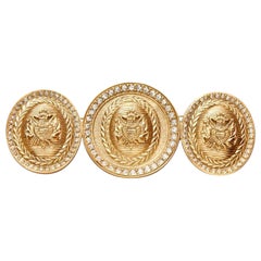 Christian Dior Broche de metal dorado