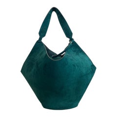 Lotus Khaite bag in petrol-colored suede.