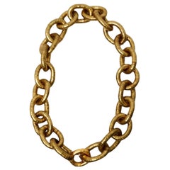 Yves Saint Laurent Goldfarbene Serpentin-Gliederhalskette mit klobiger Kette und Gliederhalskette