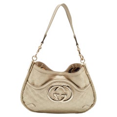 Sac Britt Hobo Gucci en cuir Guccissima crème