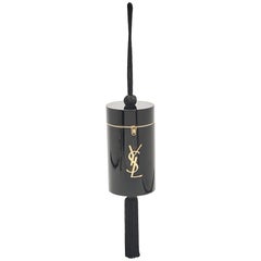 Saint Laurent Bolso de pulsera acrílico negro con borlas de noche