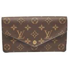 Louis Vuitton Portafoglio Jeanne in tela Monogram fucsia