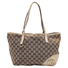 Gucci Britt Fourre-tout en toile et cuir beige/blanc cassé GG