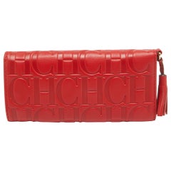 Portafoglio Trifold in pelle goffrata Monogram rosso di CH Carolina Herrera