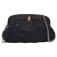 Dolce & Gabbana Schwarze Clutch mit Turnlock-Rahmen aus Spitze und Satin mit Kette