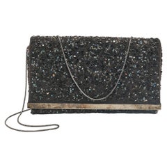 CH Carolina Herrera Schwarze Clutch aus Stoff mit Perlenverzierung und Stoffkette