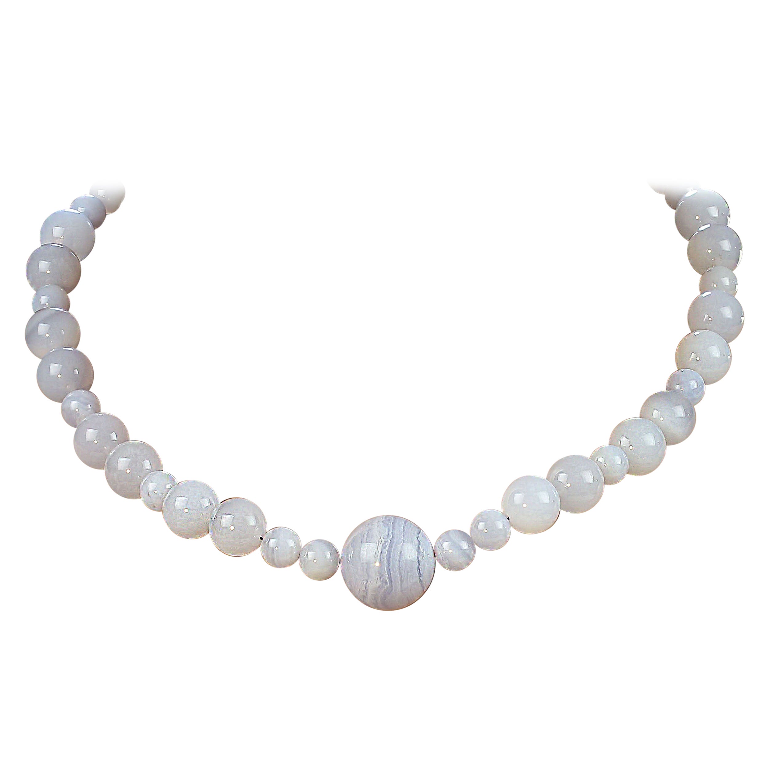 18-Inch Blue Chalcedony & Blue Lace Agate Necklace
Enhance your jewelry collection with this elegant and versatile 18-inch necklace, featuring smooth, highly polished Blue Chalcedony beads complemented by a stunning Blue Lace Agate focal. The soft,