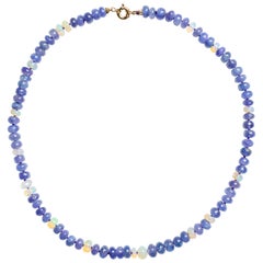Collier géant en or jaune 175 carats, perlé d'opales de feu éthiopiennes et de tanzanites