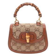 Bolso Crossbody Gucci Bamboo 1947 Mini de piel y lona marrón con purpurina