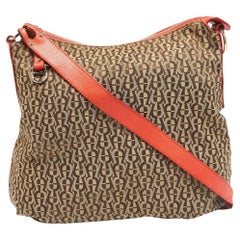 Bolso cruzado con cremallera de lona y piel con monograma beige/naranja Aigner