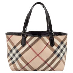 Bolso Nickie de Burberry de lona recubierta de cuadros Supernova beige y charol