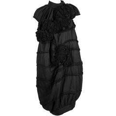 2006 COMME DES GARCONS 'tao' black dress with rosettes 3