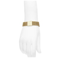 GUCCI Pulsera vintage de metal chapada en oro con logo de cota de malla
