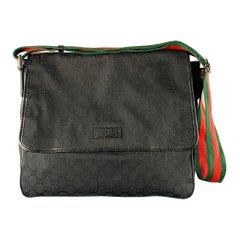 Sac messager Guccissima en toile noire, rouge et verte avec monogramme