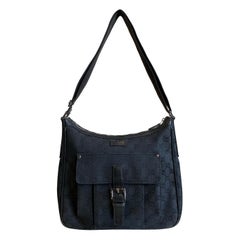 Bolso de hombro de lona con monograma GG de Gucci