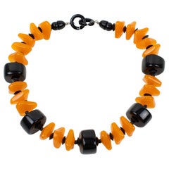 Collar gargantilla de resina naranja y negra Angela Caputi