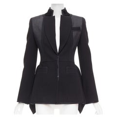 GIVENCHY 2012 Pasarela blazer peplum estructural negro con superposición de transparencias