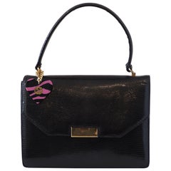 1990s Gucci vintage lizard handle bag with pink black gold heart charm