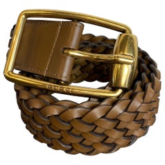 Gucci belt in braided tan leather.