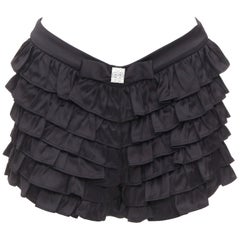 SHUSHU TONG - Pantaloncini neri in viscosa con volant e fiocco di cristallo UK6 XS