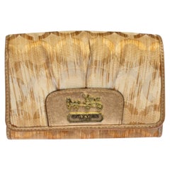 Coach Portefeuille compact caractéristique Op Art en toile et cuir couleur or