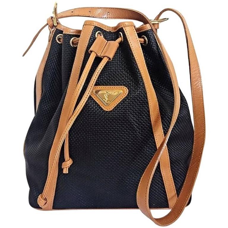 Vintage Yves Saint Laurent black hobo bucket shoulder bag with brown leather at 1stdibs