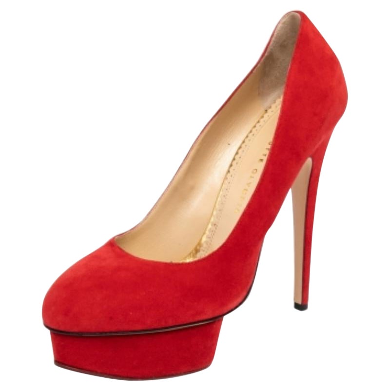 Own this meticulously designed pair of Charlotte Olympia pumps today and dazzle everyone whenever you step out! Crafted out of suede and lined with leather on the insoles, this creation is from their Dolly collection. They have been beautified with