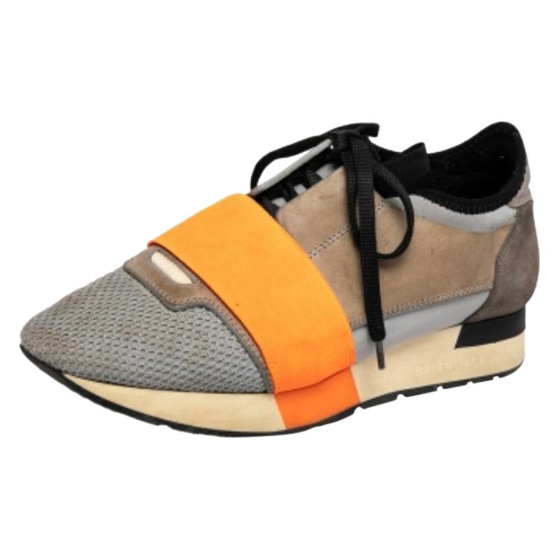 Let your latest shoe addition be this pair of Race Runners sneakers from Balenciaga. These sneakers have been crafted from quality materials and feature a chic silhouette. They flaunt covered toes, strap detailing on the vamps, and tie-up
