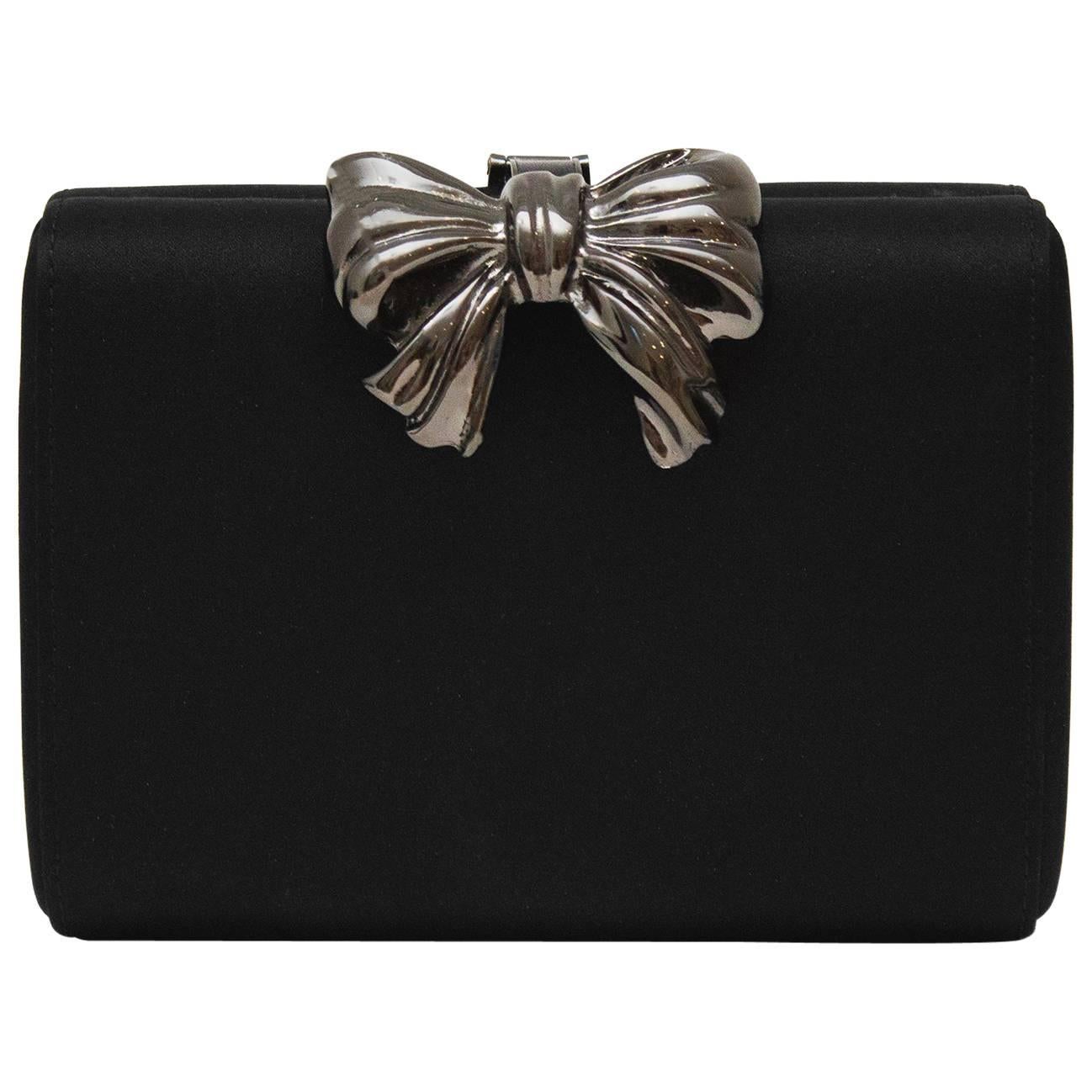 1980s Rodo Black Satin Clutch with  Metal Bow Detail  For Sale