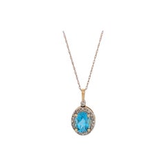 Monroe  Pendentif en or jaune 10 carats avec topaze bleue suisse ovale de 1,60 carat