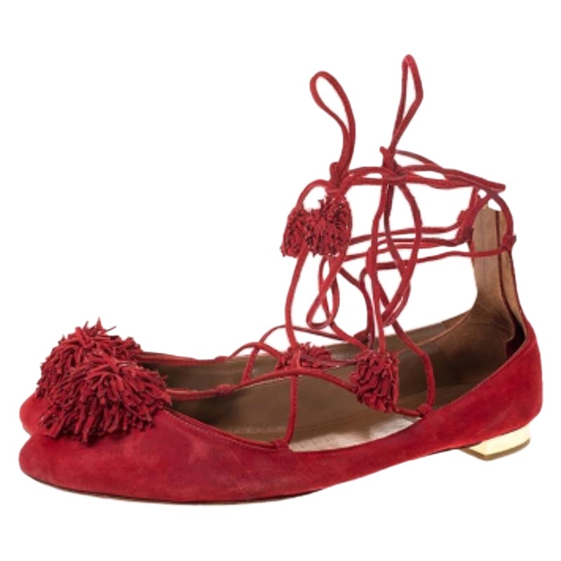 Nothing like a posh pair of ballet flats to grab the spotlight! These Aquazzura flats have been beautifully crafted from suede and styled with fringes on the uppers and ankle wraps with tassels. Complete with zip closures, gold-tone hardware and