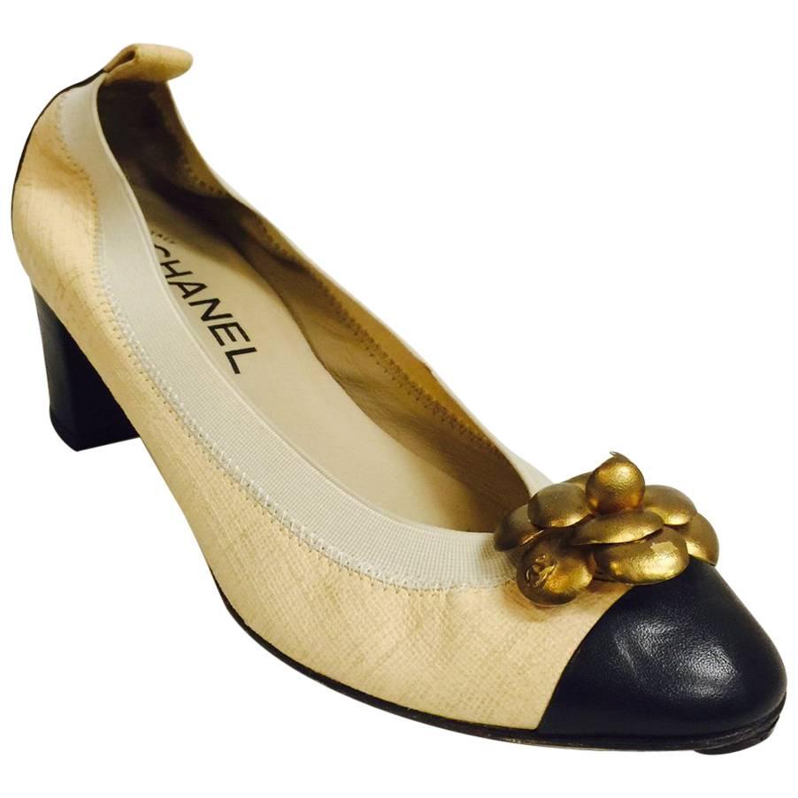 Chanel Black and Tan Pumps With Antique Gold Tone Camellia Ornaments For Sale