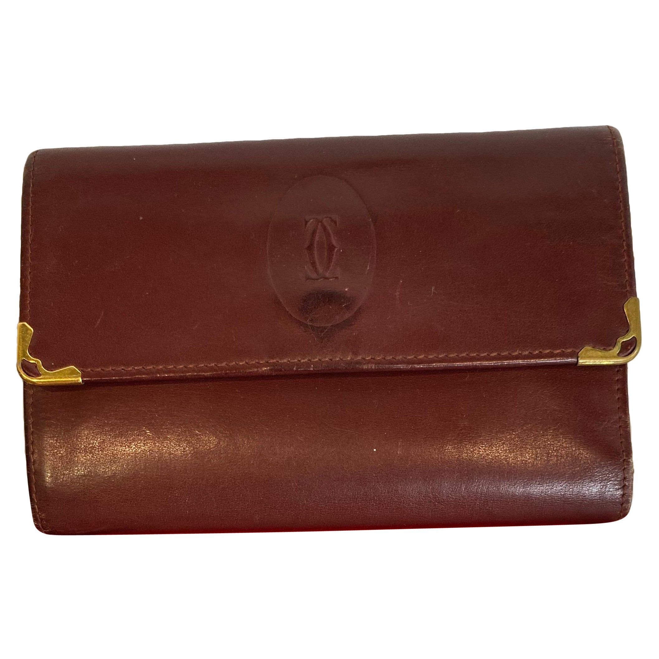 Burgundy Cartier wallet. For Sale