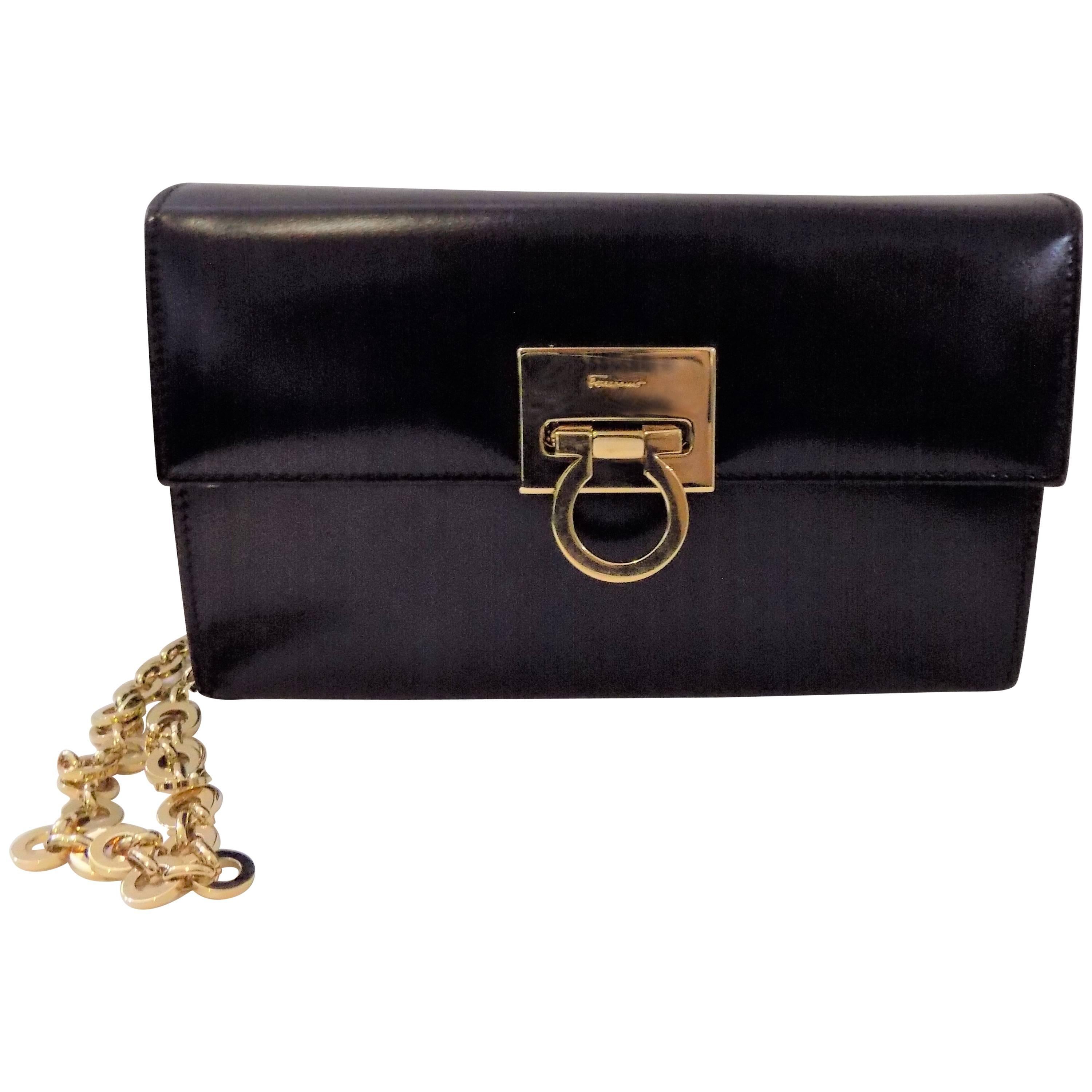  Salvatore Ferragamo black polished clutch / shoulder bag w gold chain