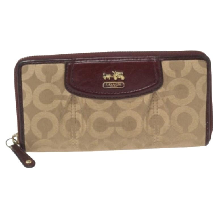 Coach Burgundy/Brown Op Art Fabric and Leather Madison Continental Wallet For Sale