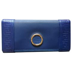 Retro Gianni Versace blue wallet with geometric pattern and logo round motif.