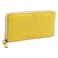 Cartera con cremallera de piel amarilla Kate Spade