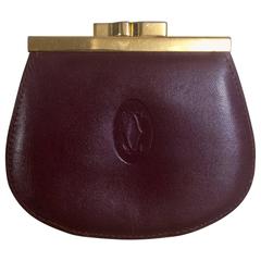 Retro Cartie wine leather coin case wallet with gold tone kiss lock closure.