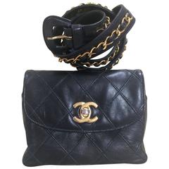 Vintage CHANEL black waist purse, fanny bag with golden chain belt and CC mark.