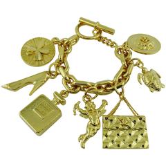 Chanel Vintage Iconic 7 Charms Gold Toned Bracelet 10